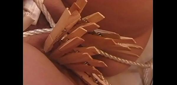  Black girl gets a rope in her pussy and a nipple blade treatment from mature dom